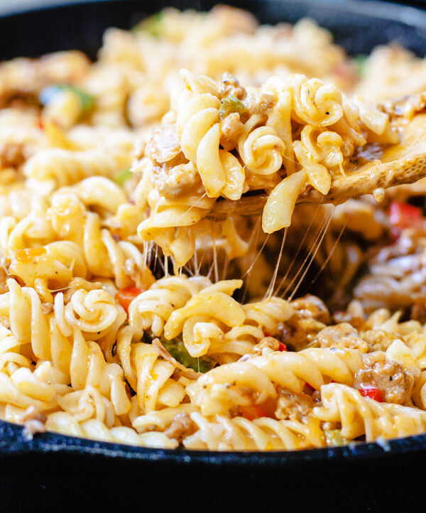 One-Skillet Macaroni and Cheese with Italian Sausage and Bell Peppers | The Mediterranean Dish. Try this delicious Italian twist on macaroni and cheese! The perfect comfort skillet meal; comes together in minutes!