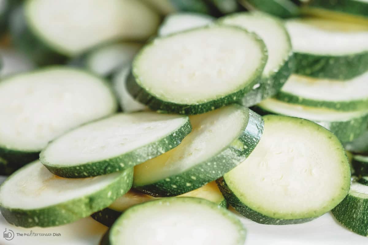 Fresh zucchini sliced into thin rounds