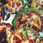 Easy zucchini recipe with balsamic reduction, sesame seeds and herbs