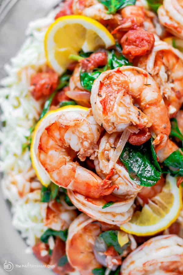 Garlic shrimp with orzo served with lemon wedges