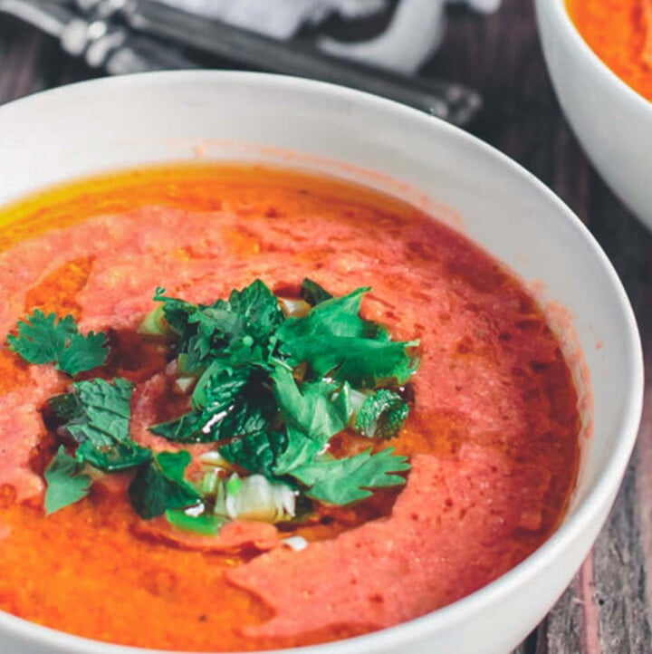 Tomato Gazpacho Soup, topped with fresh herbs