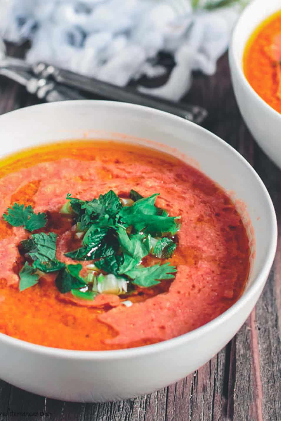 Tomato Gazpacho Soup, topped with fresh herbs