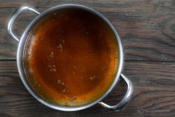 Ingredients of butter rum syrup added to a pot