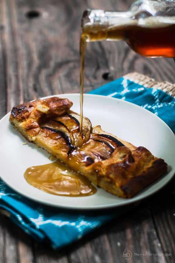 Apple Galette with Butter Rum Syrup being poured over it