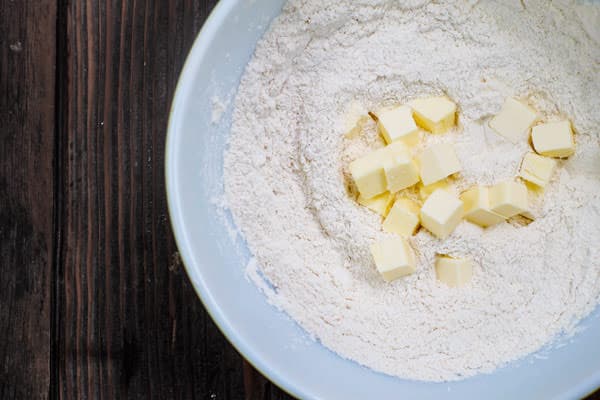 Ingredients for galette dough placed in a bowl