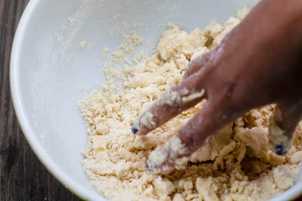 galette dough ingredients being mixed by hand