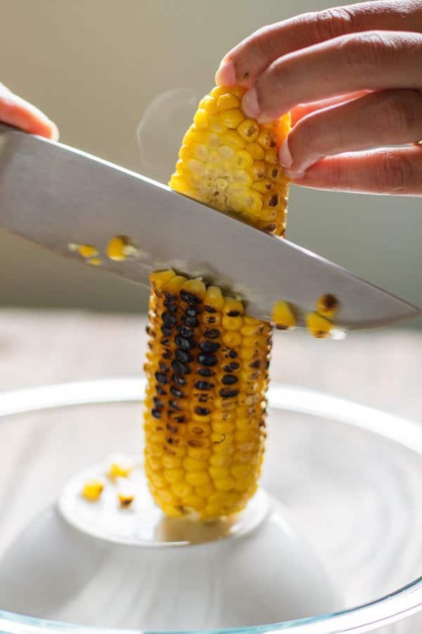 Corn being cut off the cob