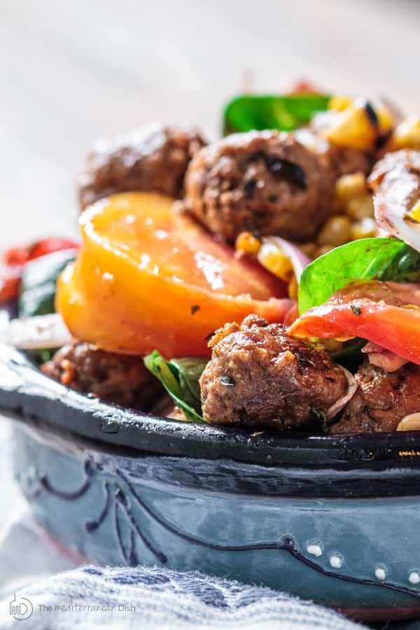 Colorful vegetables and delicious Chorizo on top of salad