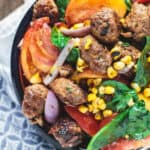 Chorizo Tomato and Charred Corn Salad | The Mediterranean Dish. Serve it as a salad, side dish or even its own meal! This exciting Mediterranean salad will be your new favorite!
