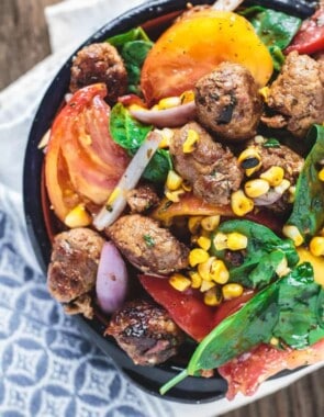 Chorizo Tomato and Charred Corn Salad | The Mediterranean Dish. Serve it as a salad, side dish or even its own meal! This exciting Mediterranean salad will be your new favorite!