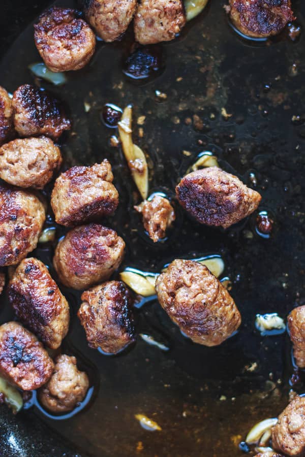 Chorizo being cooked in a skillet