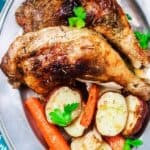 Rosemary Roasted Chicken Recipe with Vegetables | The Mediterranean Dish. A simple and satisfying one-pan roasted chicken recipe packed with flavor from Mediterranean spices including rosemary and a generous amount of lemon juice and olive oil. A healthy and cozy fuss-free dinner!