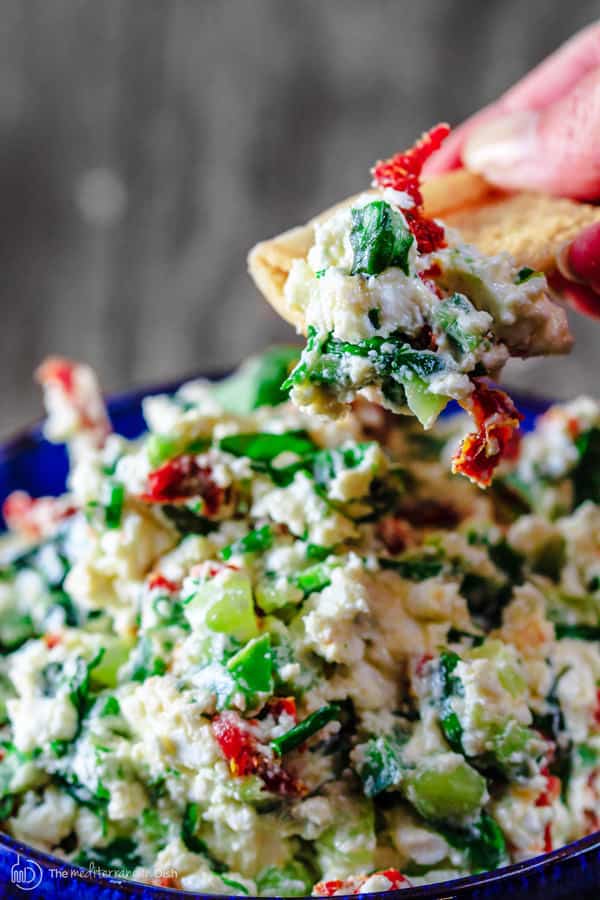 Mediterranean Feta Cheese Dip | The Mediterranean Dish. An impressive 5-minute cheese dip with feta, fresh basil, chives, sun-dried tomatoes! A last-minute impressive appetizer for your special dinners or holiday party!