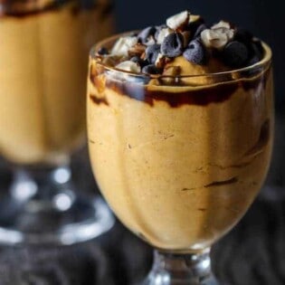 5-Minute Pumpkin Greek Yogurt Parfait | The Mediterranean Dish. Pumpkin puree, Greek yogurt, a little mascarpone with brown sugar, molasses! Top with chocolate chips and your favorite nuts! The perfect gluten-free Thanksgiving treat...but if you ask me, I'll have this for breakfast any day!