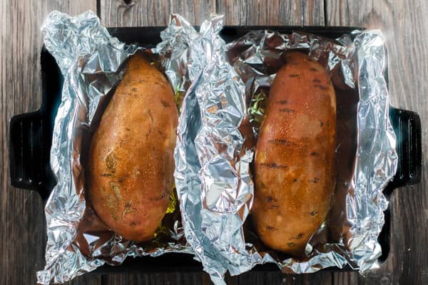 Sweet Potatoes in a baking pan in aluminum foil