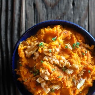 Roasted Mashed Sweet Potatoes with Thyme and Molasses | The Mediterranean Dish. Do not hide your mashed sweet potatoes underneath marshmallows. Try this simple, rustic and flavor packed mashed sweet potatoes instead. The perfect Thanksgiving dish.