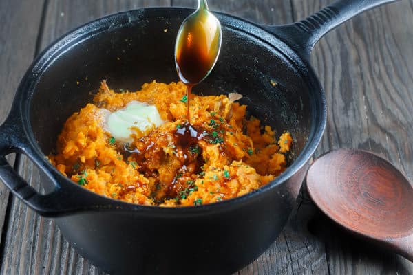 Molasses added to pot of mashed sweet potatoes