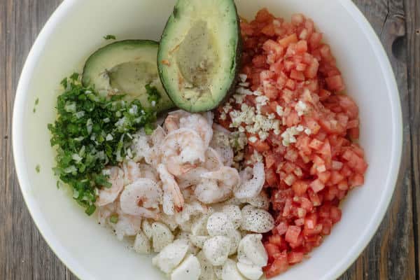 Ingredients for Shrimp Bruschetta arranged in a bowl before mixing