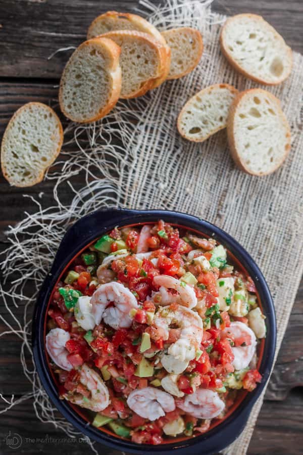 Prepared Shrimp Bruschetta with slices of bread on side to be combined