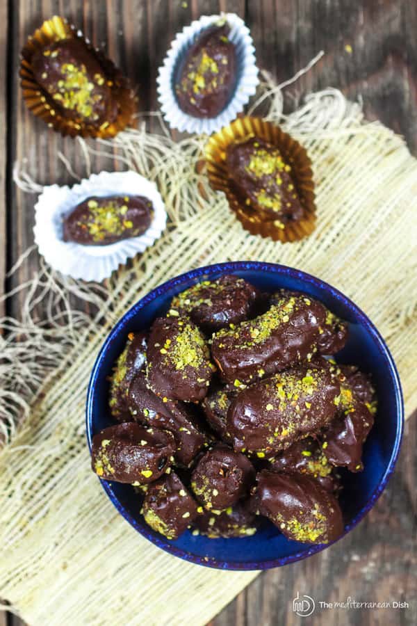 Chocolate Covered Date garnished with crushed nuts