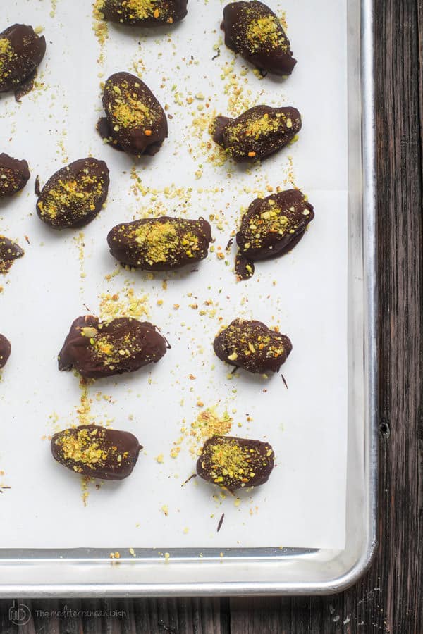 Chopped nuts added to tops of chocolate dates