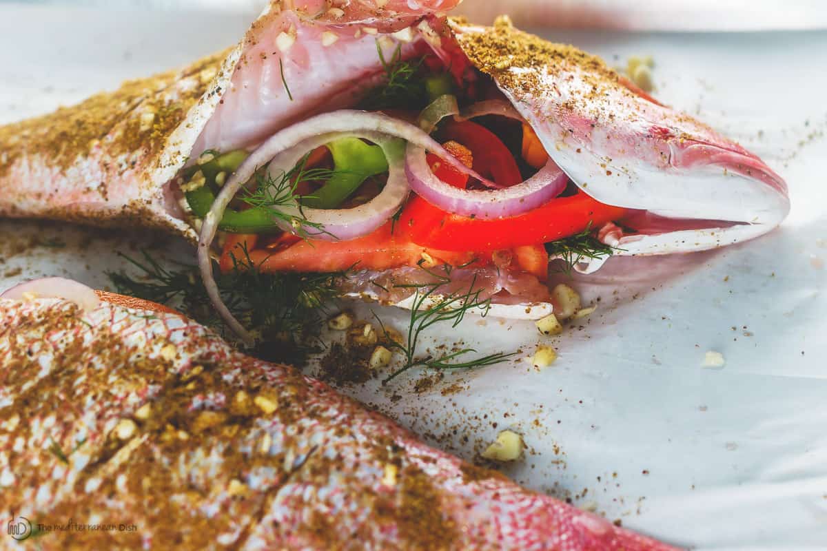 Whole red snapper stuffed with vegetables and herbs