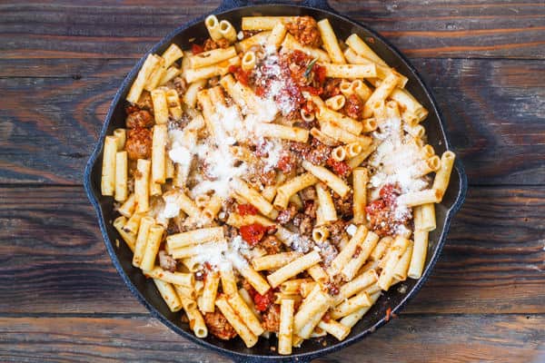 Ziti added to skillet of sausage and tomato sauce