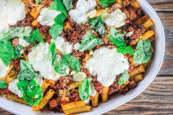 Baked ziti garnished with fresh basil