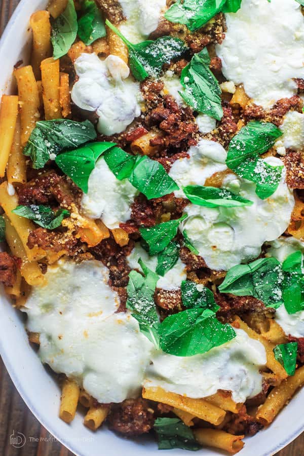 Baked Ziti served in a platter with Italian Sausage and Fresh Mozzarella