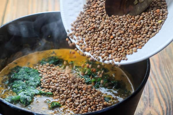 Mediterranean Spicy Spinach Lentil Soup Recipe | The Mediterranean Dish. A nutritious, flavor-packed lentil soup that comes together in minutes. Following the Mediterranean diet is easy with meals like this lentil soup!