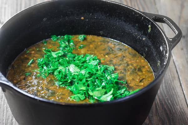 Mediterranean Spicy Spinach Lentil Soup Recipe | The Mediterranean Dish. A nutritious, flavor-packed lentil soup that comes together in minutes. Following the Mediterranean diet is easy with meals like this lentil soup!