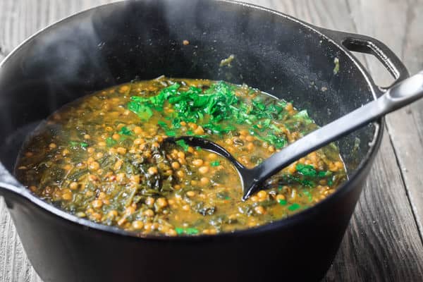 Mediterranean Spicy Spinach Lentil Soup Recipe | The Mediterranean Dish. A nutritious, flavor-packed lentil soup that comes together in minutes. Following the Mediterranean diet is easy with meals like this lentil soup!