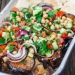 Mediterranean Za’atar Chickpea Salad Recipe with Fried Eggplant | The Mediterranean Dish. A flavor-packed Mediterranean peasant salad with chickpeas, chopped vegetables, eggplant and Za’atar. A meal in its own right! Get the step-by-step tutorial.