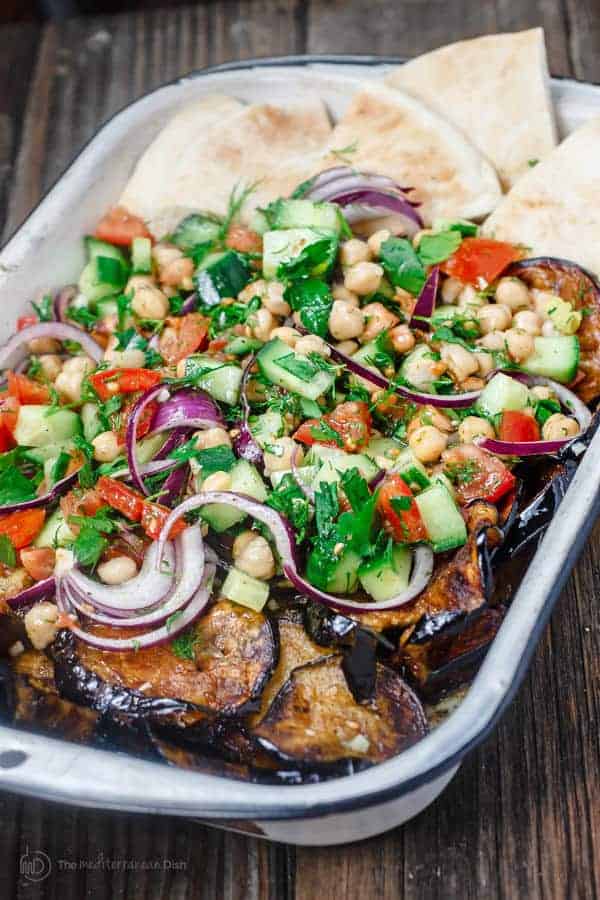 Mediterranean Za’atar Chickpea Salad Recipe with Fried Eggplant | The Mediterranean Dish. A flavor-packed Mediterranean peasant salad with chickpeas, chopped vegetables, eggplant and Za’atar. A meal in its own right! Get the step-by-step tutorial.