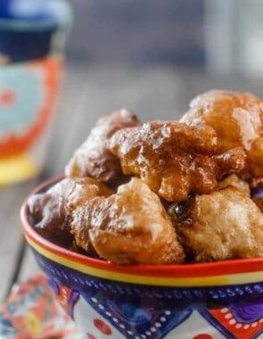 Middle Eastern Vegan Donuts (Zalabia) | The Mediterranean Dish. Simple, free-form vegan donuts; crisp and drenched in a cinnamon syrup. Make sure you make enough because these are addictive!