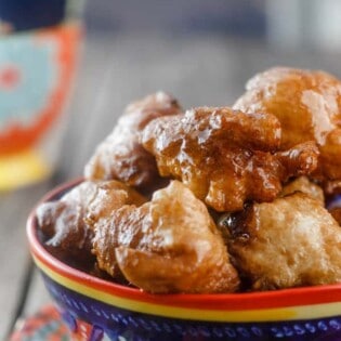 Middle Eastern Vegan Donuts (Zalabia) | The Mediterranean Dish. Simple, free-form vegan donuts; crisp and drenched in a cinnamon syrup. Make sure you make enough because these are addictive!