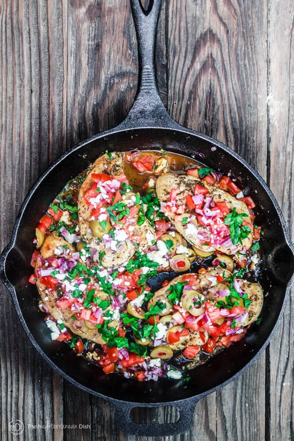 One skillet Mediterranean chicken with tomatoes, onions, olives and feta