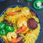 Spicy couscous with shrimp and chorizo served in a bowl
