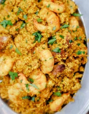 Spicy couscous with shrimp and chorizo served in a bowl