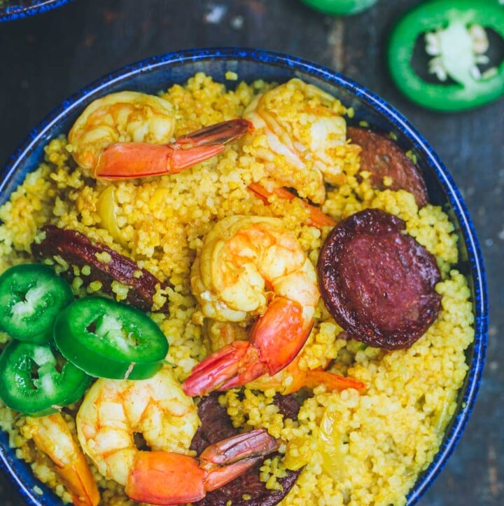 Spicy couscous with shrimp and chorizo served in a bowl