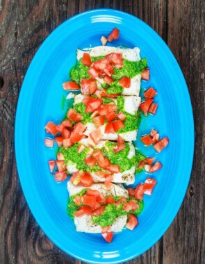 Baked Cod Recipe with Pistachio Cilantro Pesto | The Mediterranean Dish. A 25-minute baked cod dinner with bold flavors from cilantro, garlic, and lemon juice. See the two-step recipe on The Mediterranean Dish today!