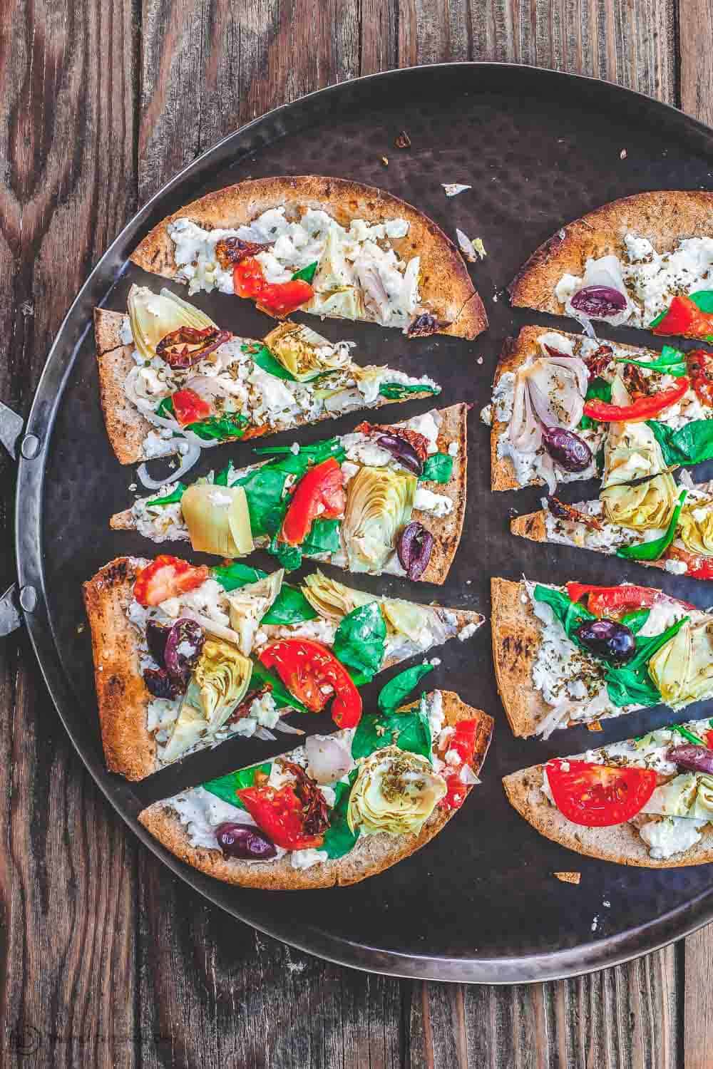 Flatbread pizza slices on a platter 