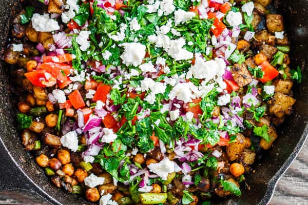 Mediterranean Potato Hash garnished with feta cheese and parsley