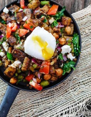 Mediterranean Potato Hash Recipe | The Mediterranean Dish. An easy breakfast hash with potatoes, chickpeas, asparagus, tomatoes and Mediterranean spices and fresh herbs. Comes together in less than 30 mins. See the step-by-step today on The Mediterranean Dish.