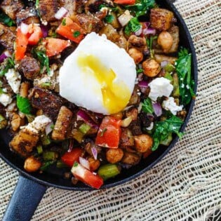 Mediterranean Potato Hash Recipe | The Mediterranean Dish. An easy breakfast hash with potatoes, chickpeas, asparagus, tomatoes and Mediterranean spices and fresh herbs. Comes together in less than 30 mins. See the step-by-step today on The Mediterranean Dish.