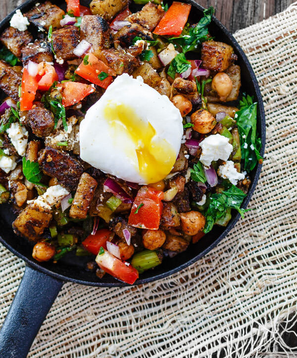 Mediterranean Potato Hash Recipe | The Mediterranean Dish. An easy breakfast hash with potatoes, chickpeas, asparagus, tomatoes and Mediterranean spices and fresh herbs. Comes together in less than 30 mins. See the step-by-step today on The Mediterranean Dish.