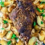 Mediterranean-style Leg of Lamb Recipe | The Mediterranean Dish. Leg of lamb covered in a Mediterranean rub of fresh garlic, spices, olive oil and lemon juice. Roasted with potato wedges and served over rice pilaf. A delicious Easter recipe or for your next family dinner! Recipe comes with step-by-step photos!