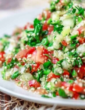 Tabouli Recipe | The Mediterranean Dish. Authentic Middle Eastern tabouli salad with fresh parsley, mint, bulgur, finely chopped vegetables and a simple citrus dressing. See the step-by-step tutorial at The Mediterranean Dish food blog.