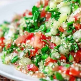 Tabouli Recipe | The Mediterranean Dish. Authentic Middle Eastern tabouli salad with fresh parsley, mint, bulgur, finely chopped vegetables and a simple citrus dressing. See the step-by-step tutorial at The Mediterranean Dish food blog.