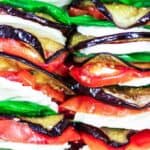 Roasted Eggplant Caprese Salad Recipe | The Mediterranean Dish. A satisfying appetizer or even side dish! Roasted eggplants, tomatoes, and melted mozzeralla cheese with basil nestled in between. Dressed in a simple basil viniagrette! See the step-by-step tutorial on The Mediterranean Dish